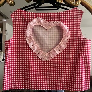 cute sleeve-less shirt with heart shape cut out on back!